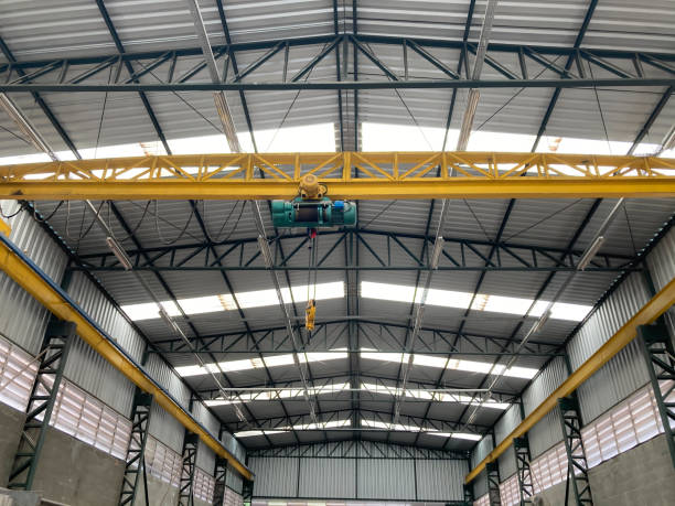 Industrial shed with mobile winch highlighted. Ecologic daylight illumination.